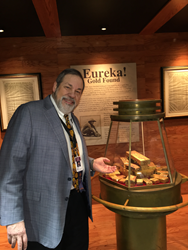 Michael Fuljenz, President of Universal Coin & Bullion in Beaumont, Texas, with some of the historic California Gold Rush assayers’ ingots recovered from the fabled “Ship of Gold,” the SS Central America.