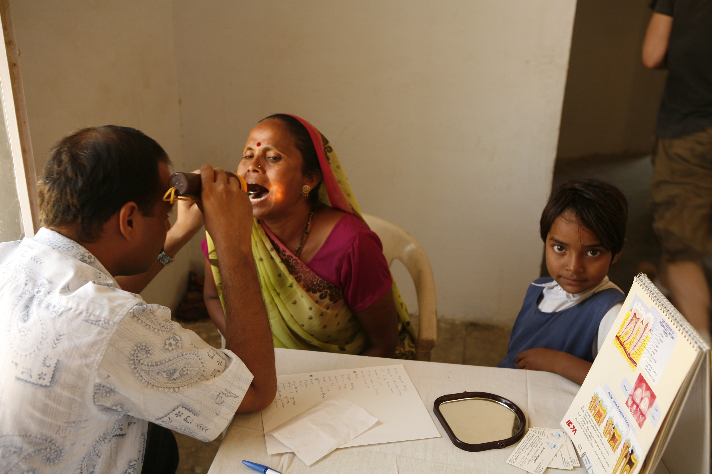 RRI's Dentist treating patients at our free medical camp in Khirod, Rajasthan