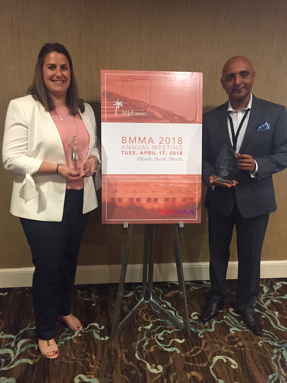 Kelly Champagne of F-Secure and Sandeep Shashikant of Frontier accept the BMMA Best in Class Partnership Marketing Award at the 2018 BMMA Annual Meeting in Atlantic Beach, FL.