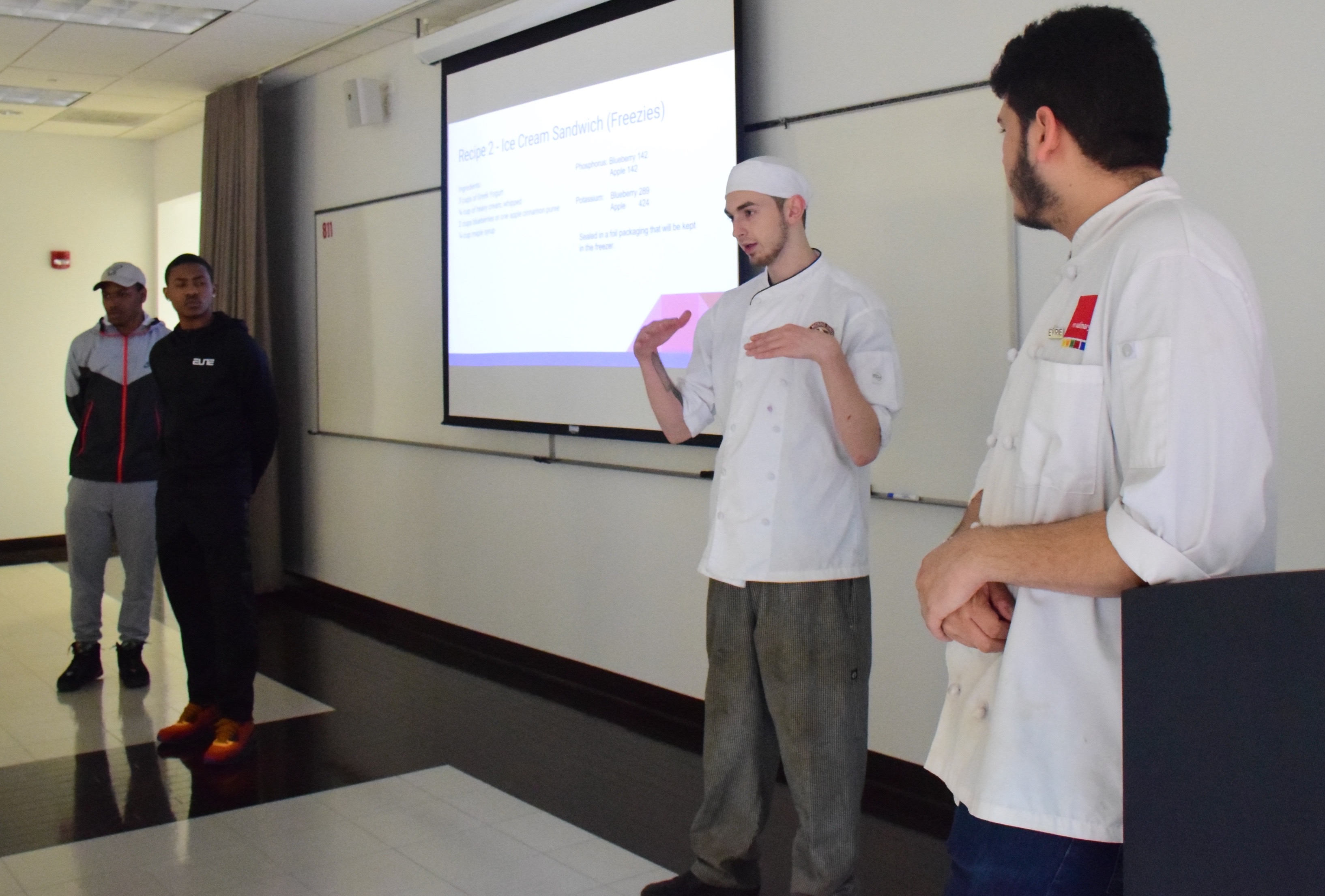 RMU students explain the nutritional values for each dish presented during the tasting.