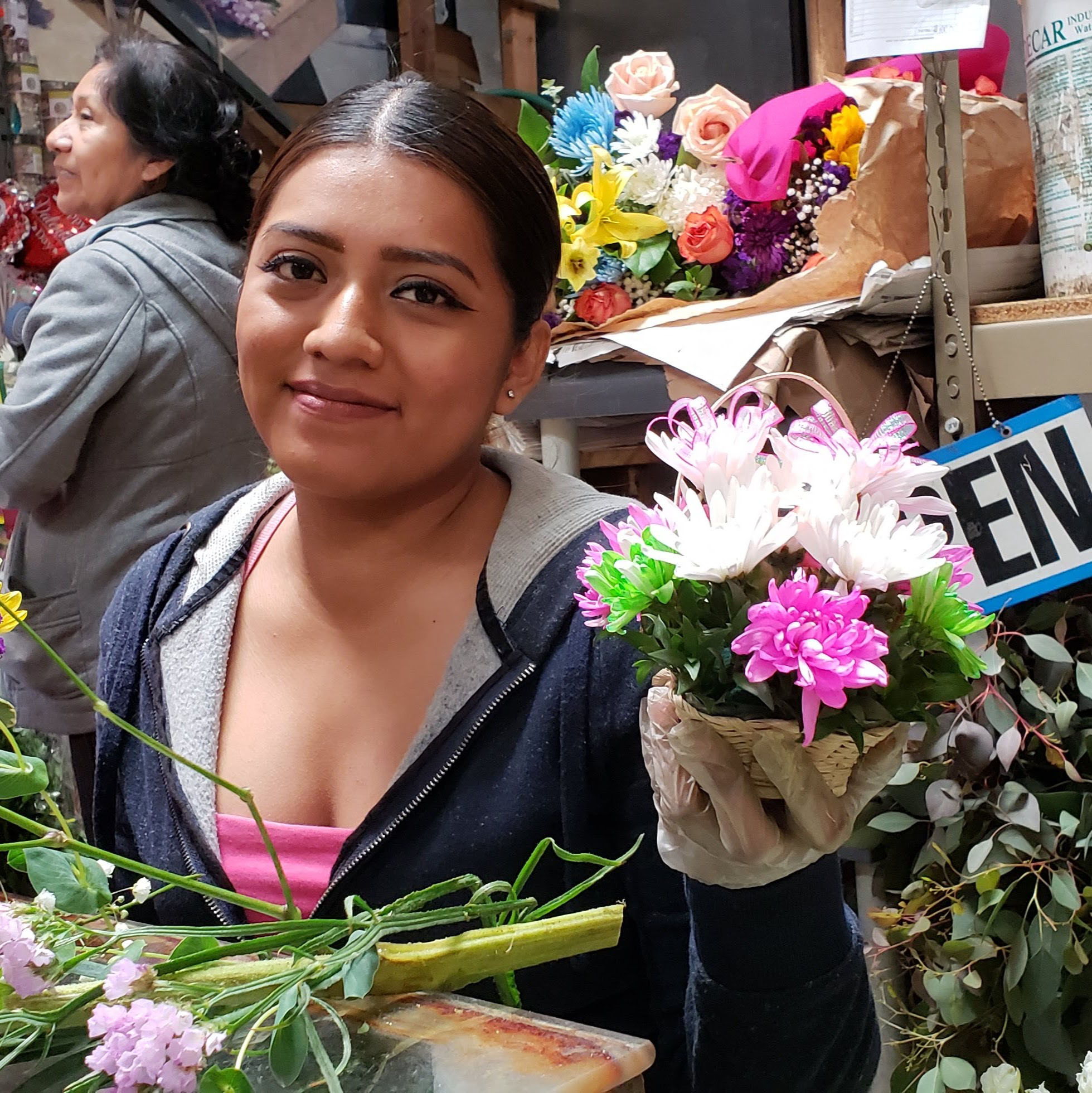 Miriam Cazares co-owner of Cazares Flowers displays a mini fairy flower basket