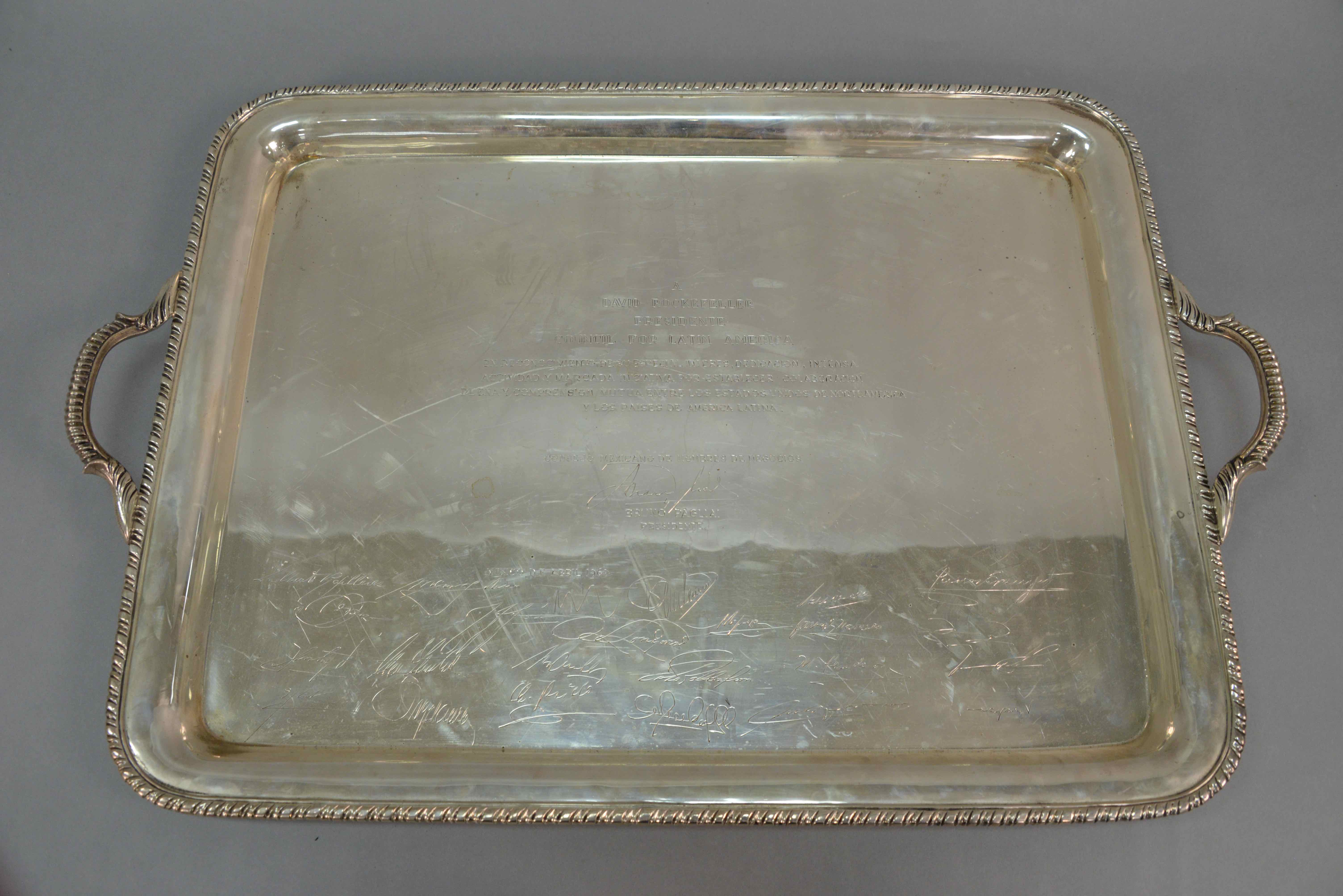 Sterling silver monogrammed handled tray, estimated at $2,000-3,000.