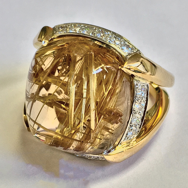 Rutilated Quartz Ring by Jeffrey Bilgore.  24.65ct sugarloaf rutilated quartz, 20 round diamonds, 18 yellow gold, and platinum.