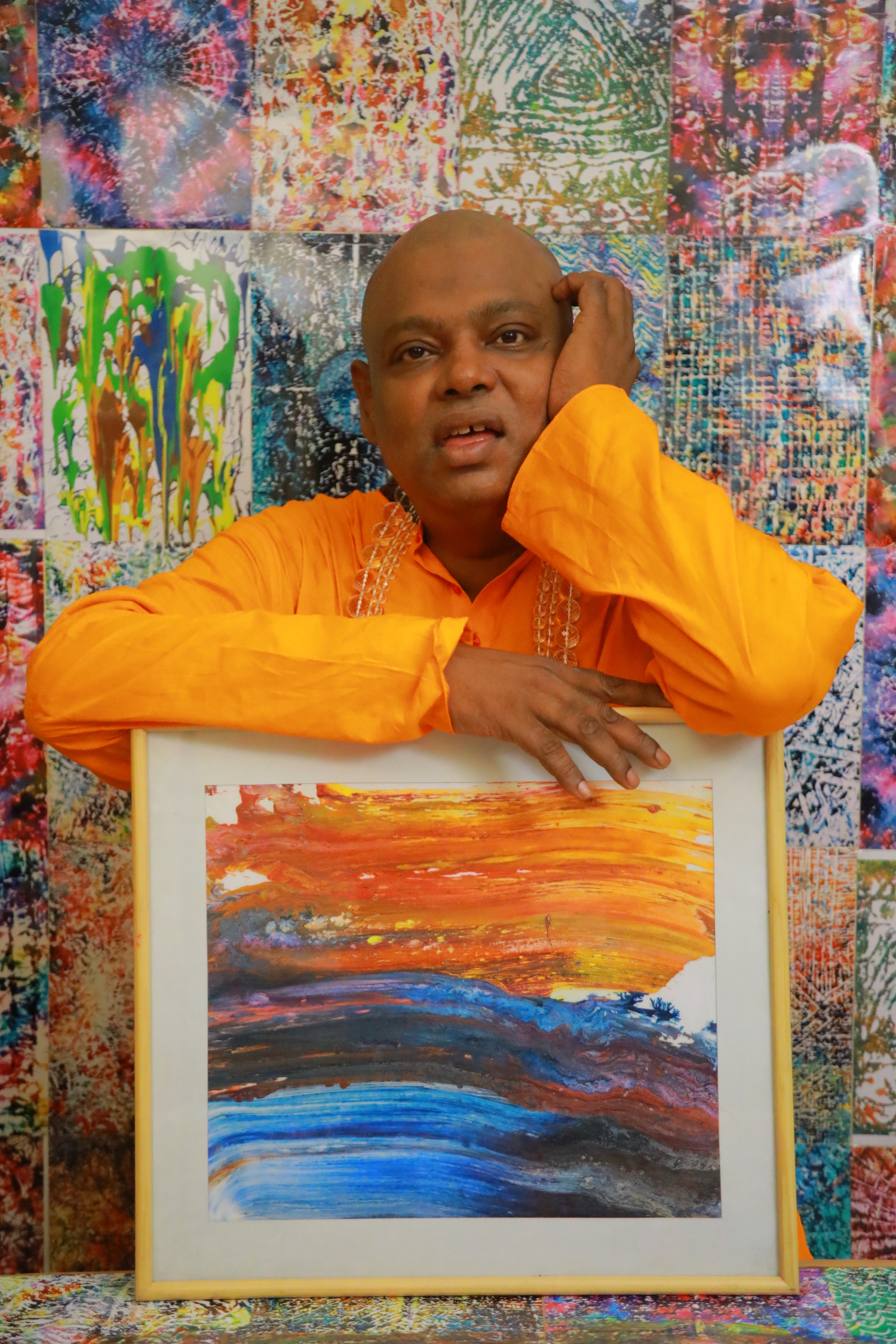 Parijoy Saha with the World's fastest abstract painting made in a 1/5th fraction of a second.