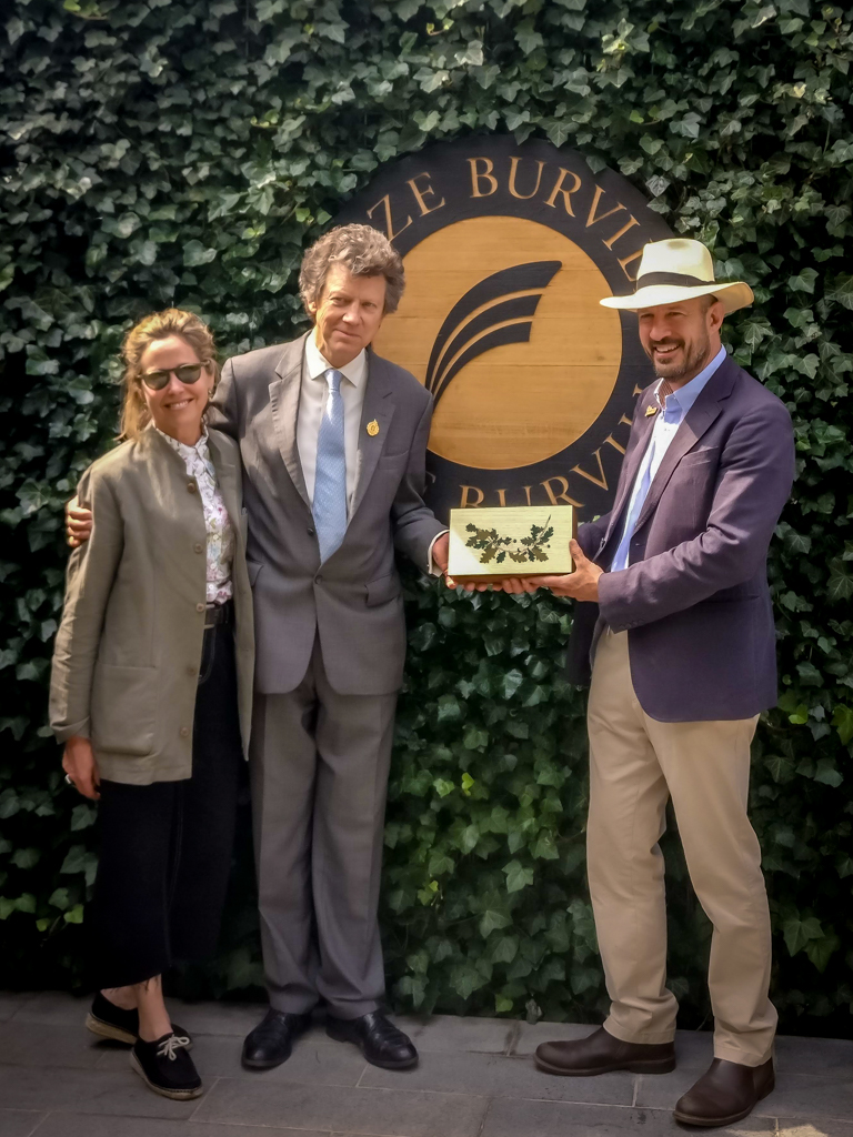 Simon Burvill and Butter Wakefield receive the Best Tradestand award from RHS President Sir Nicholas Bacon Bt, OBE, DL at the RHS Chelsea Flower Show 2018