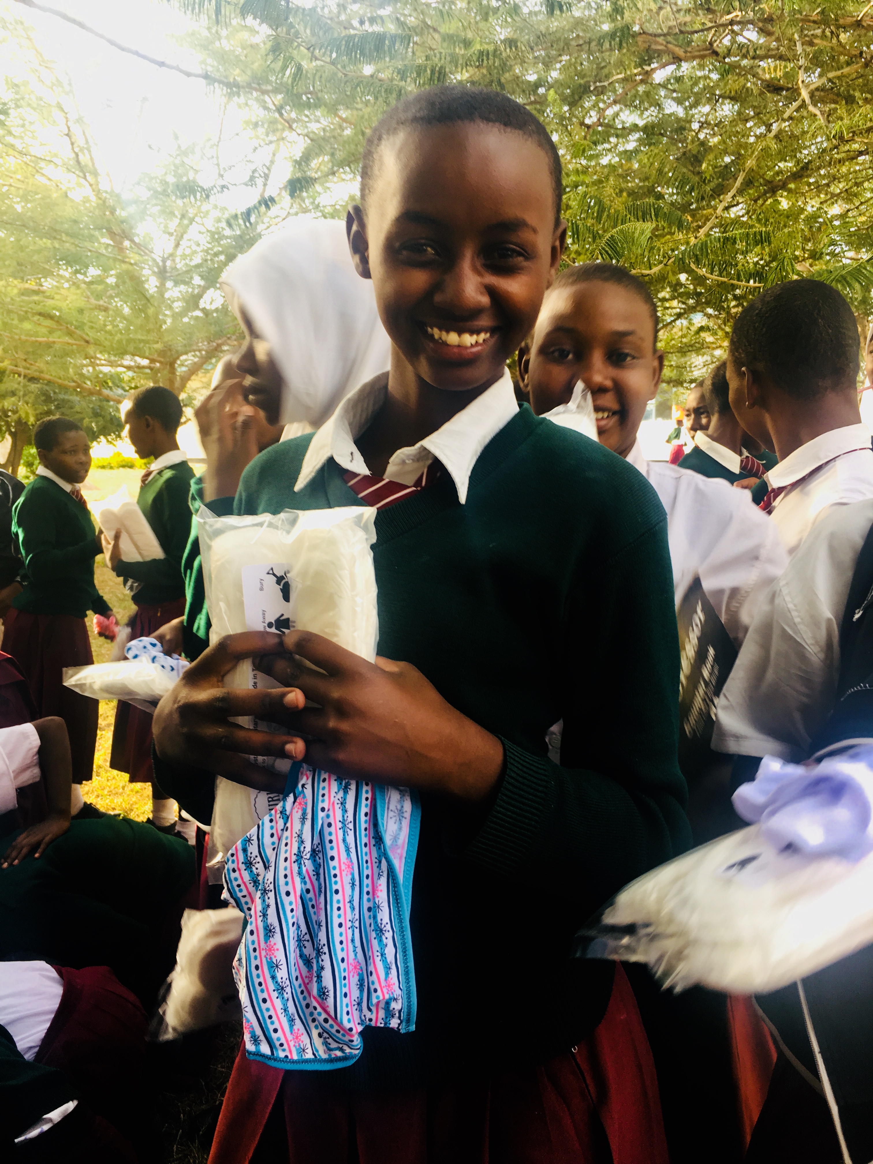 Tanzanian School Girl Receiving Sanitary Pads and Undergarments