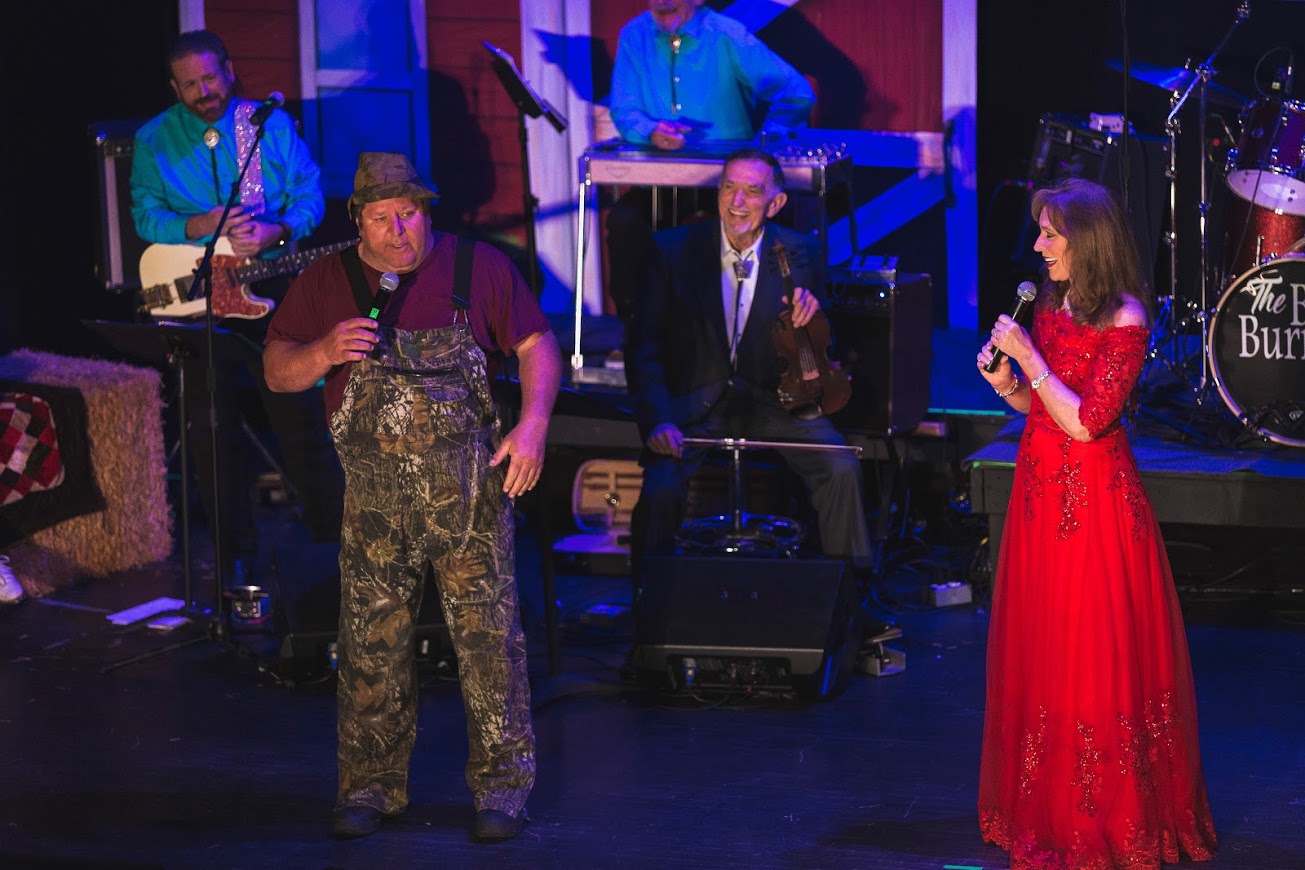 Comedian Lee Blasingame banters with Donna Meade as part of the Old Dominion Barn Dance tradition.