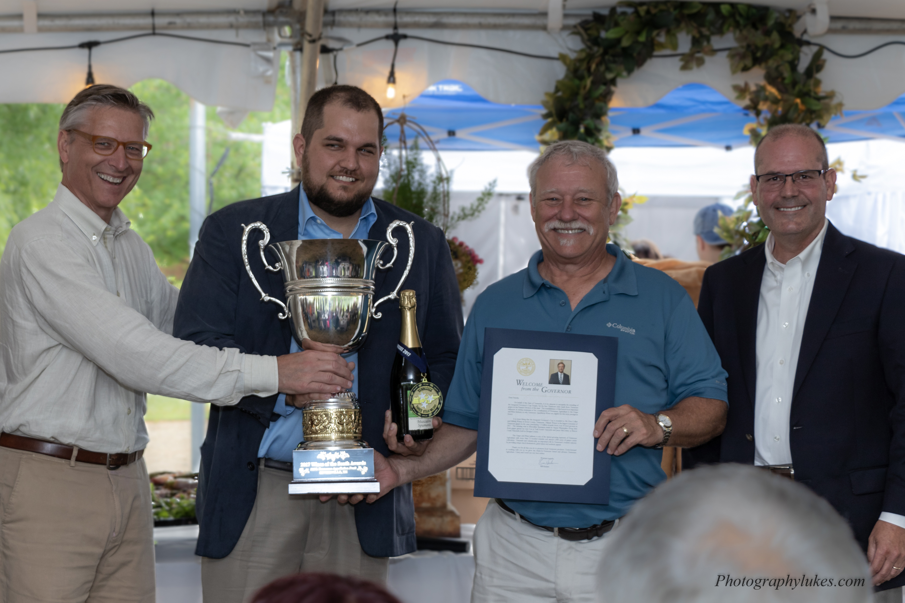 Tennessee Deputy Commissioner of Agriculture Tom Womack, right, presented the new Tennessee Governor’s Cup Award to winery and vineyard owners May 18.