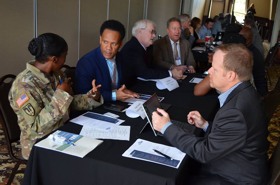 Army Contracting Summit attendees participate in matchmaking sessions.