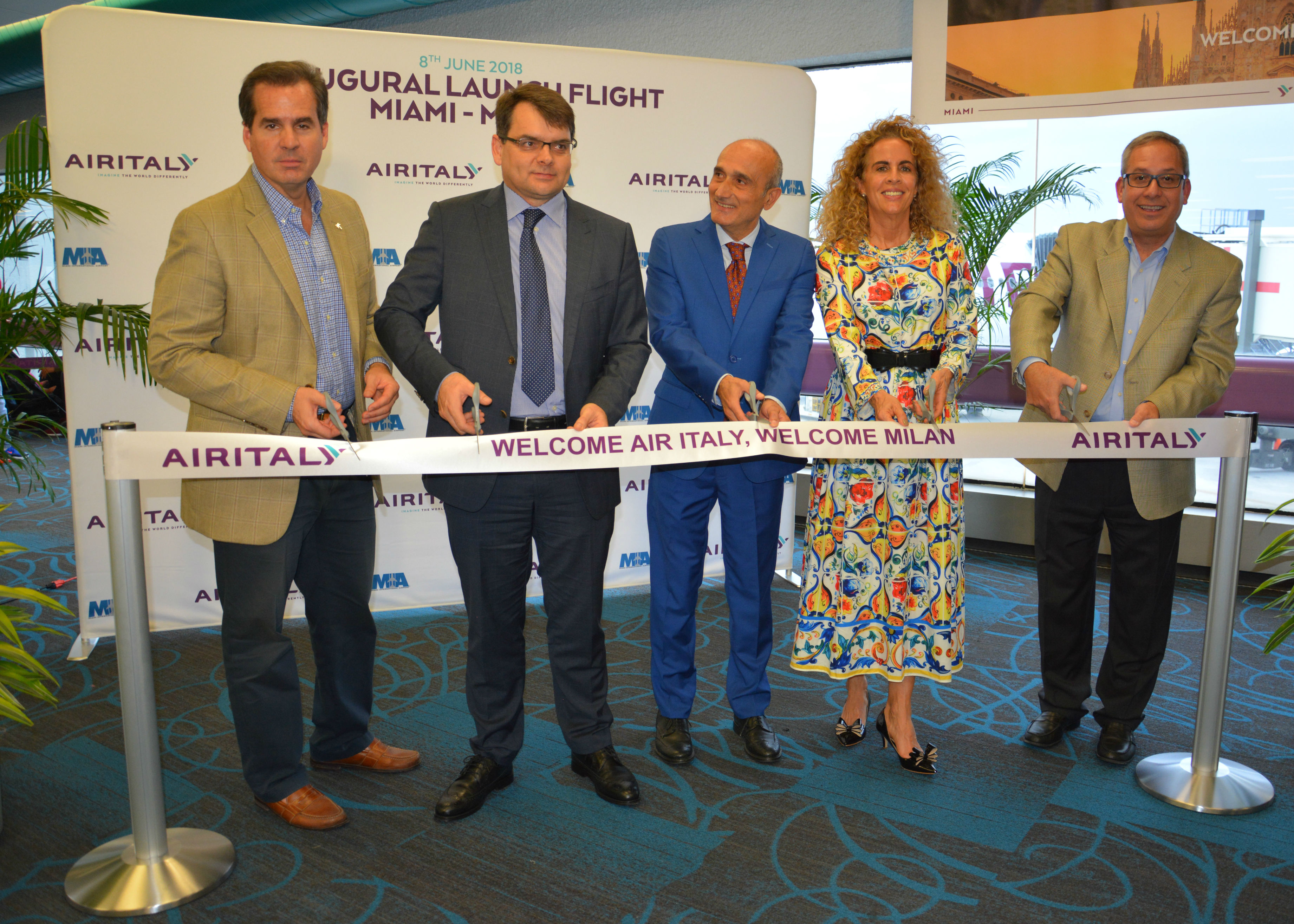 Officials celebrate Air Italy’s launch at MIA with a ribbon-cutting.