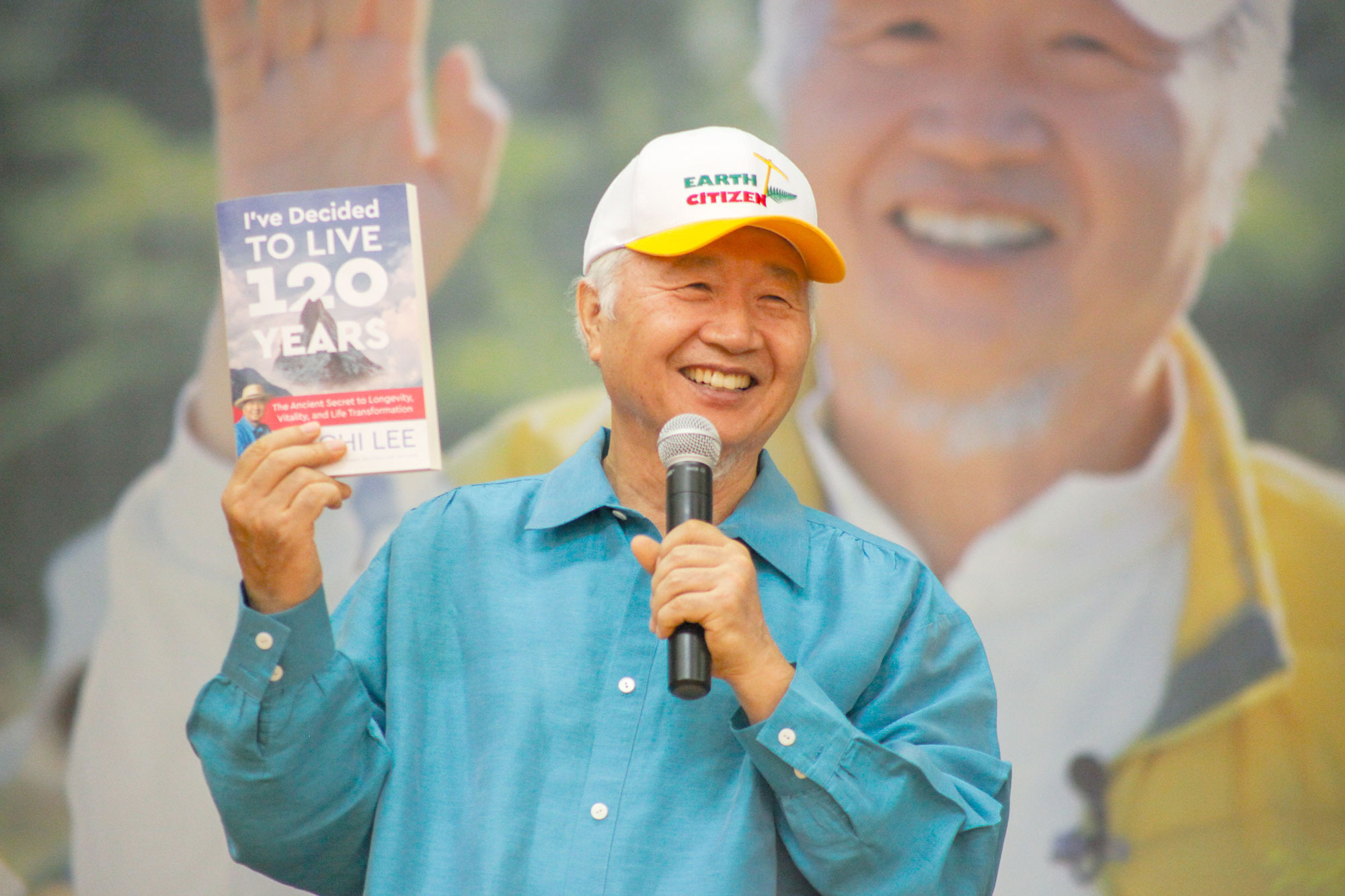 Ilchi Lee with his book, "I've Decided to Live 120 Years: The Ancient Secret to Longevity, Vitality, and Life Transformation"
