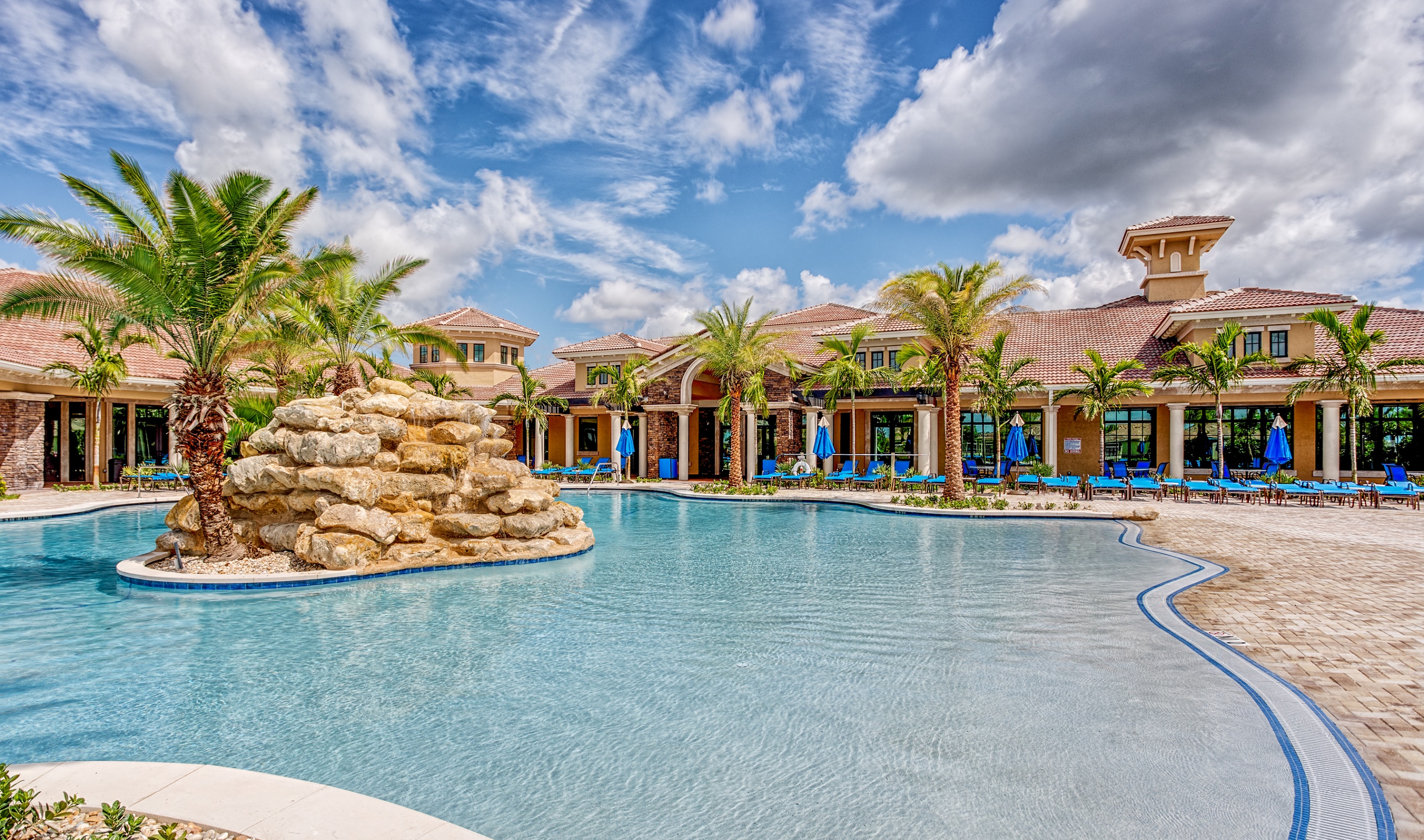 Residents of K. Hovnanian’s® Four Seasons at Parkland enjoy access to a tropical style, beach-entry swimming pool, separate lap pool, and heated spa and cabana,  among a host of other amenities.