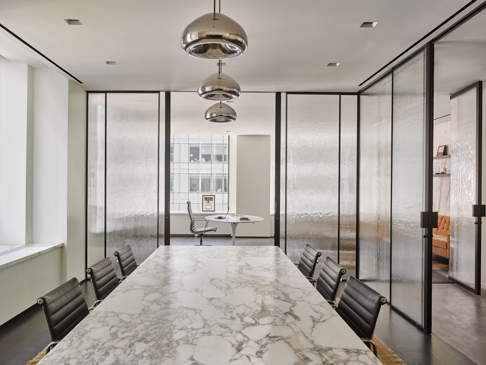 Private office with partitions featuring new "Waterfall" textured glass