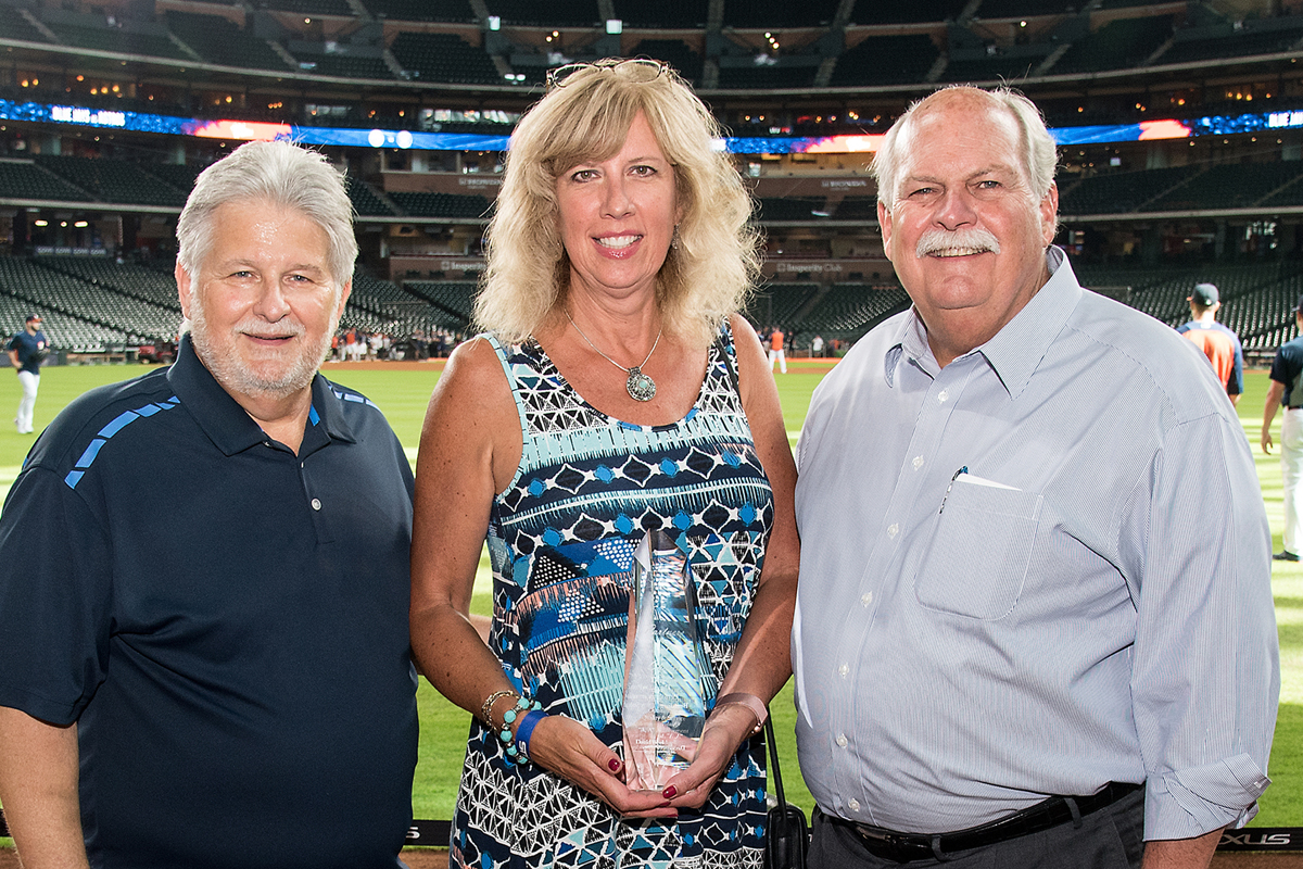 Left to right: Bill Justus, vice president, David Weekley Supply Chain Services; Linda Marquess, national sales account manager, DuPont Safety &   Construction; and David Weekley, chairman.