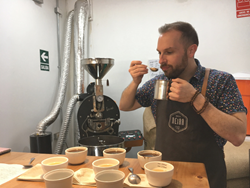 Brandon Bir of Crimson Cup Coffee and Tea cups coffee in Peru