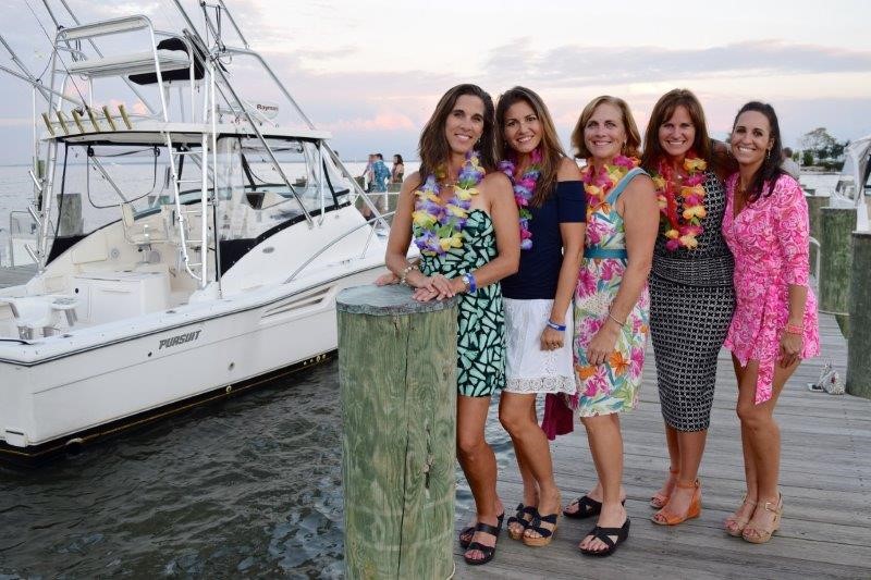 Event Attendees enjoy the waterview at the Boatyard Beach Bash