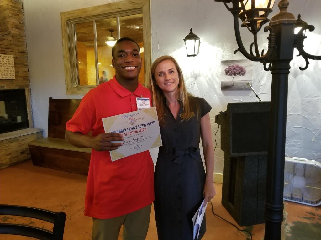 Carrie Weiler, Director of HYPE and the Mentoring Children of Prisoners Program, with scholarship recipient Damon Rodgers.