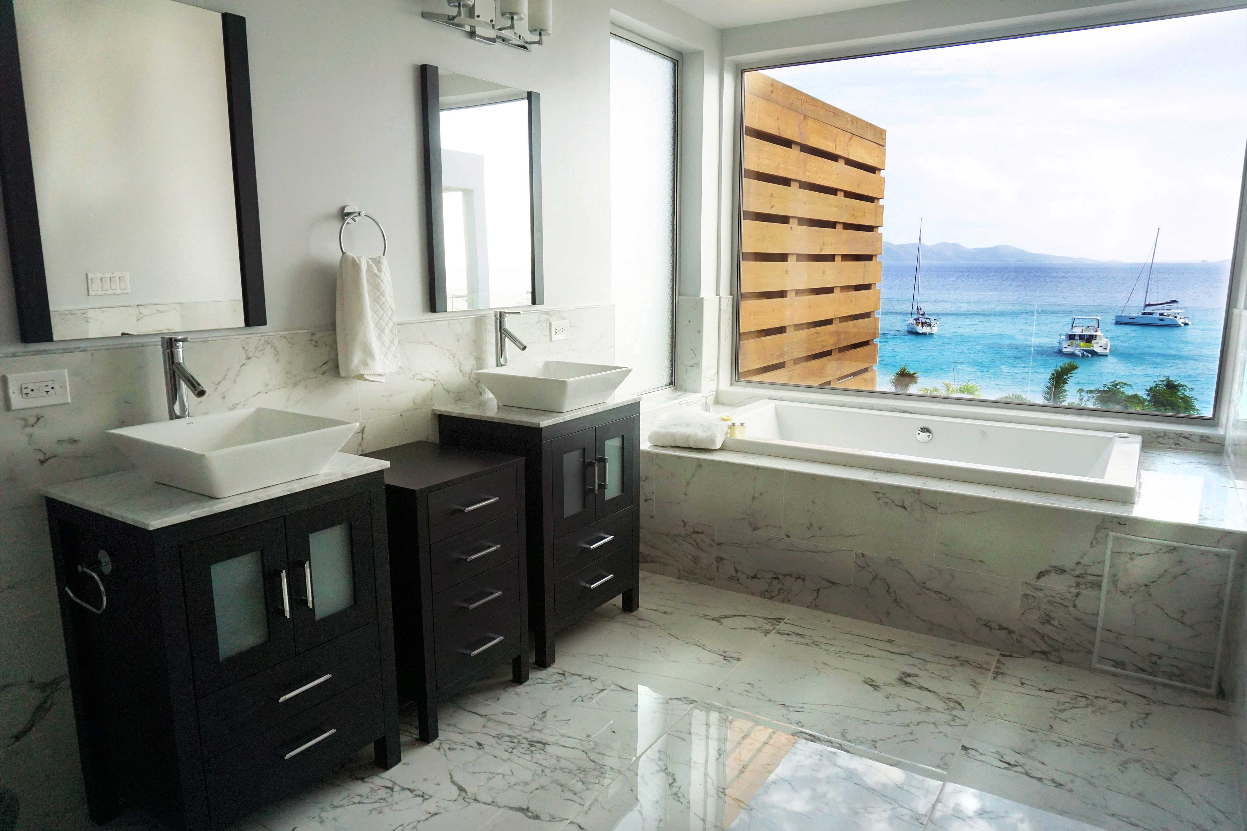 One of three master bathrooms with fill from the ceiling bathtubs.