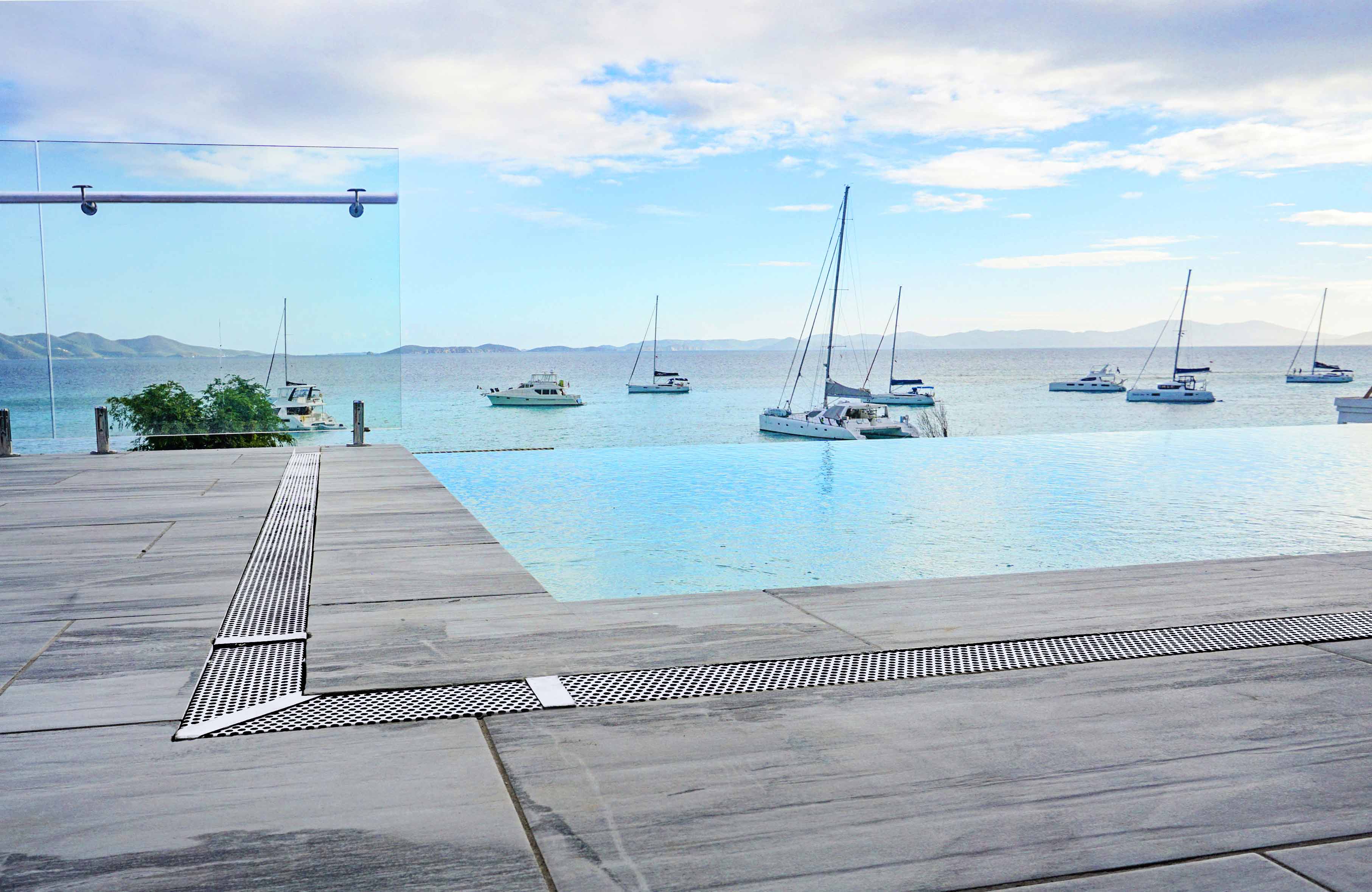 Watch sailboats touch the horizon while swimming in the infinity pool.