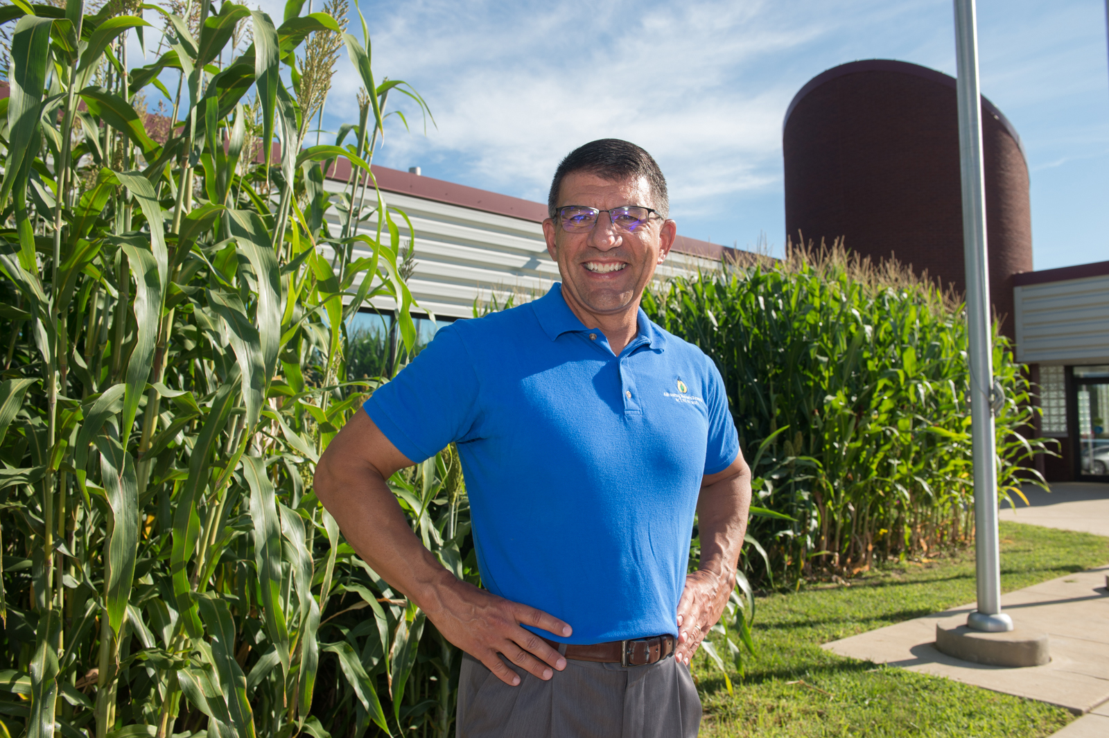 John Caupert, director of the NCERC at SIUE, stands in front of the Feedstock Diversity Showcase.