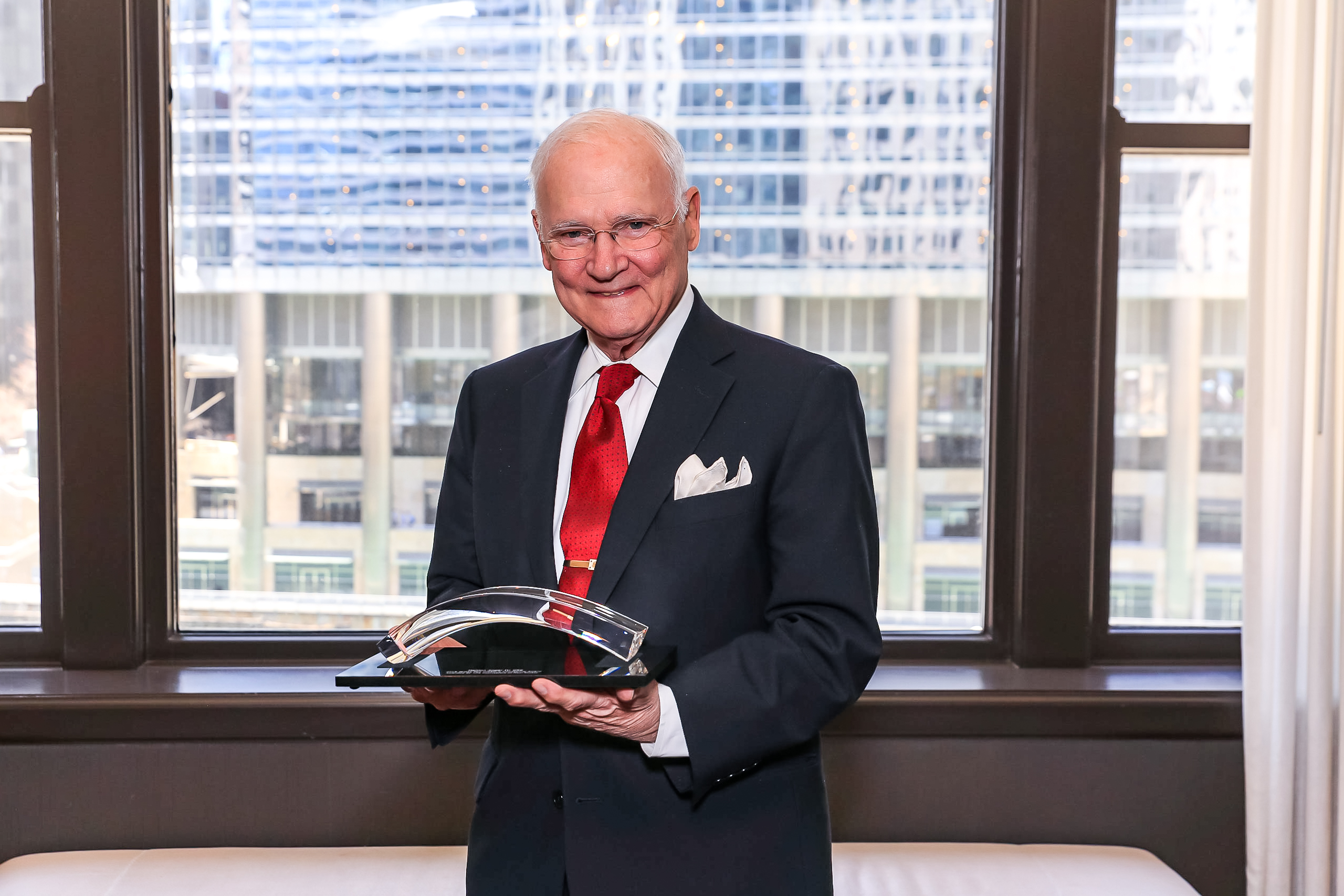 Mahlon (Sandy) Apgar IV, CRE, with his award for creative counseling from The Counselors of Real Estate professional association.