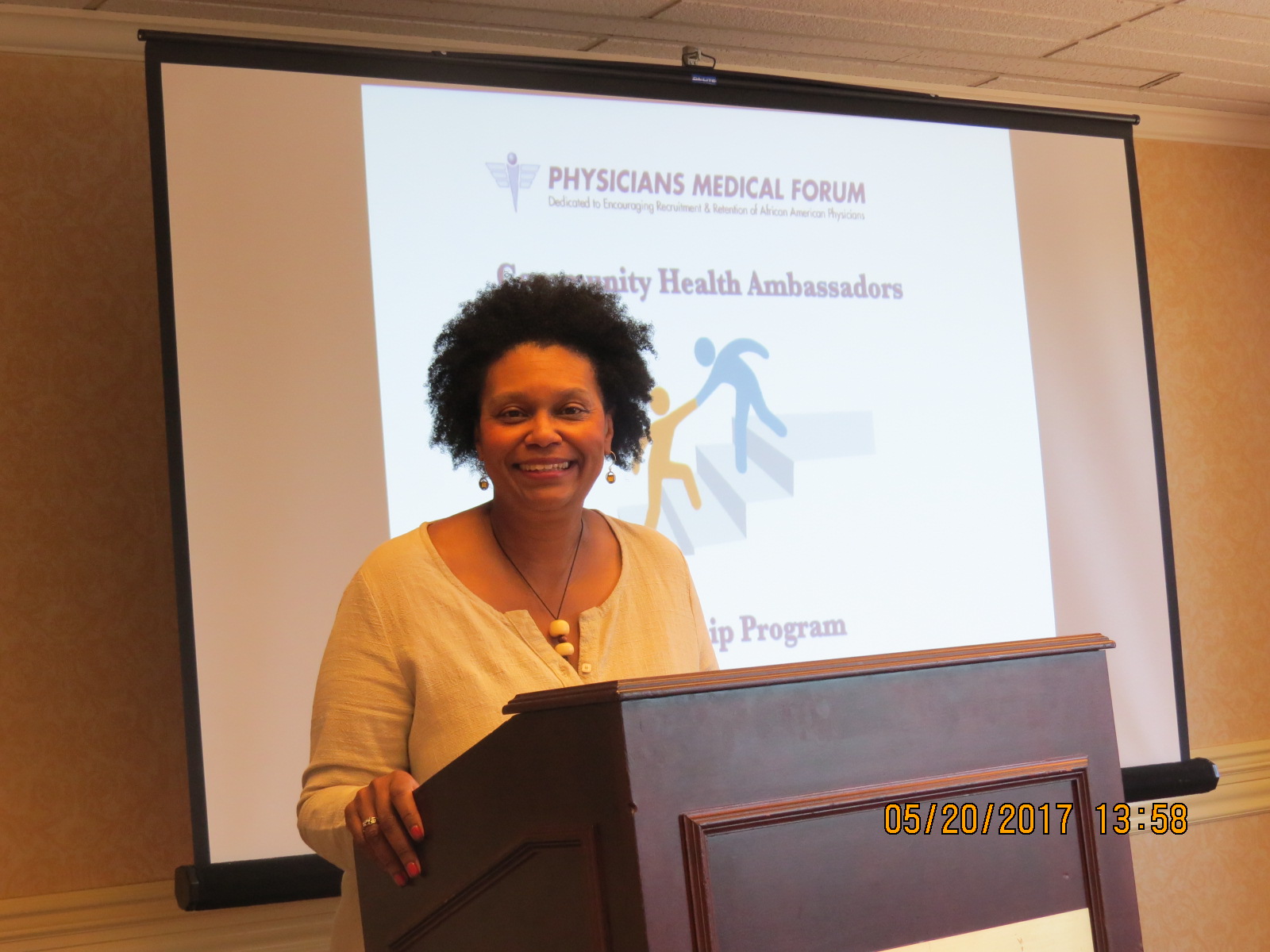 Dr. Kathryn E. Malone congratulations students at closing ceremony and awarding of certificates of completions