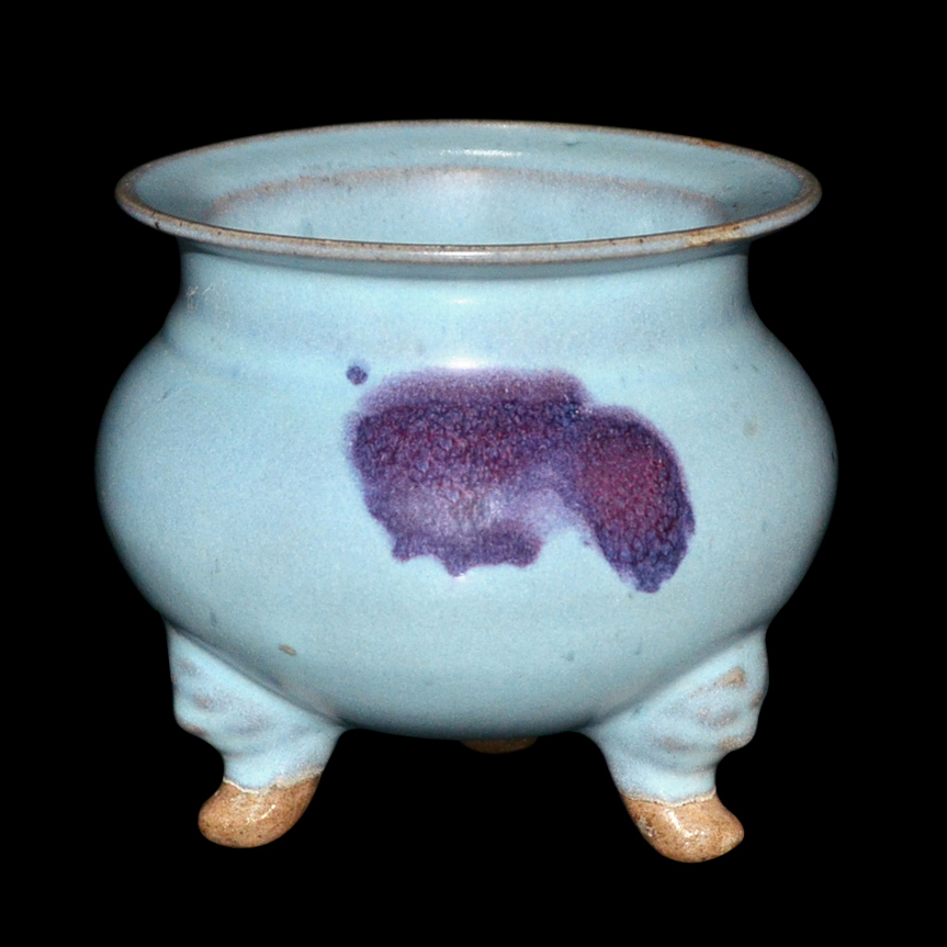 Soft blue glazed tripod censer with purple splash.