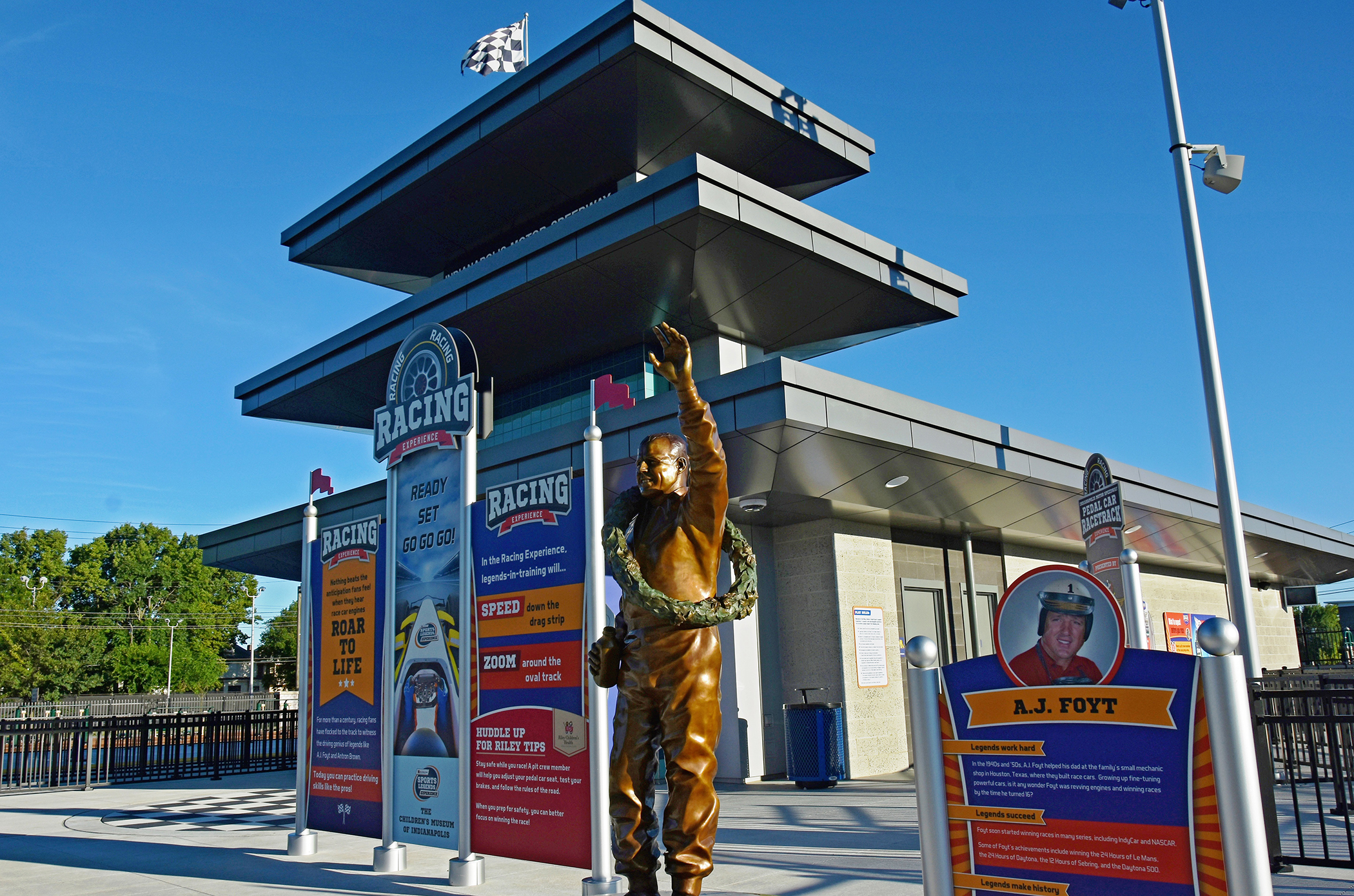 A.J. Foyt bronze sculpture next to miniature Indianapolis Motor Speedway pagoda