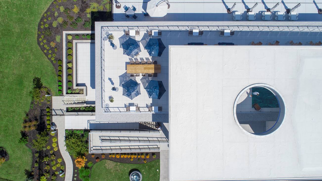 The Cambridge Club amenities include a 25,000-square-foot clubhouse with a fine dining restaurant, 5,000-square-foot pool pavilion building, rooftop deck, lounges, fitness area and spa.