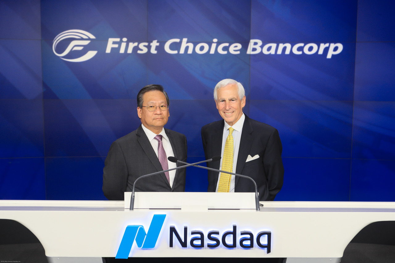 Peter Hui and Robert Franko ringing the NASDAQ closing bell