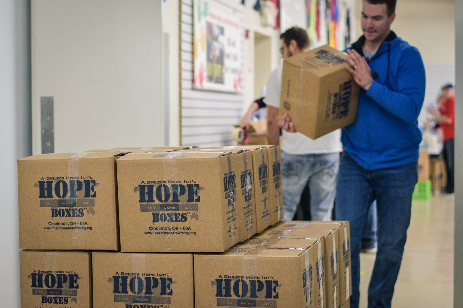 Whitewater Crossing church attenders packed food to send at A Child’s Hope International - Hands Against Hunger’s facility. (Whitewater Crossing photo)