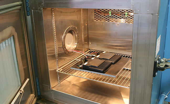 A test chamber simulates different environmental conditions to gauge product performance.