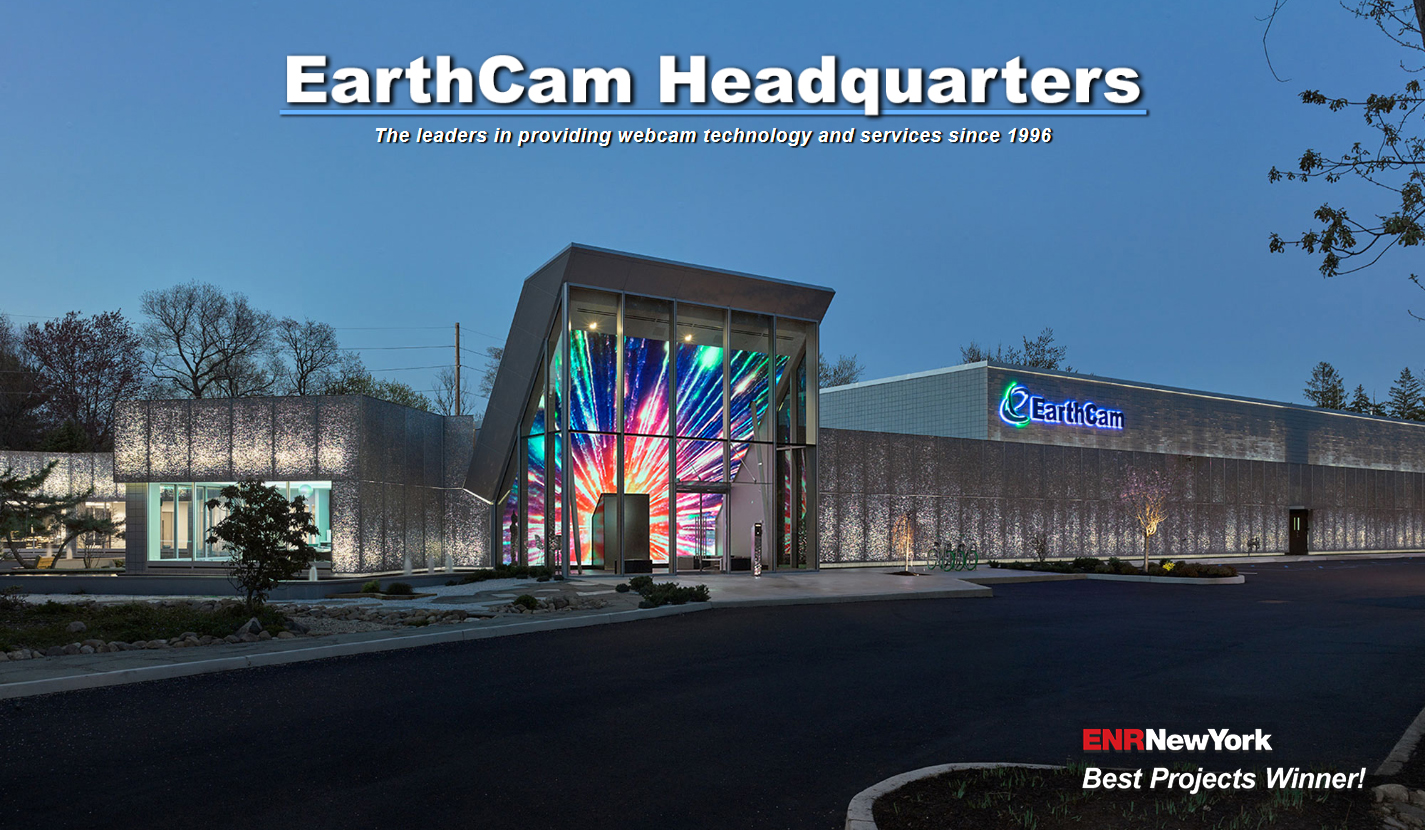 Visitors to the EarthCam Headquarters are greeted by an enormous, sloping 25-foot tall video portal encased in an almost 3-story glass curtain wall atrium.