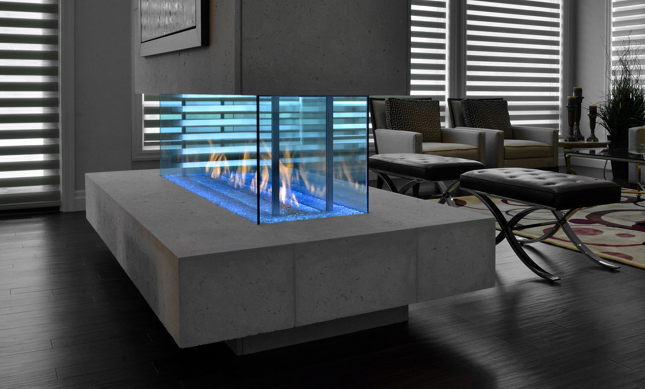 See-through fireplaces of horizontal design have the capability to warm multiple rooms. Photo: Travis Industries