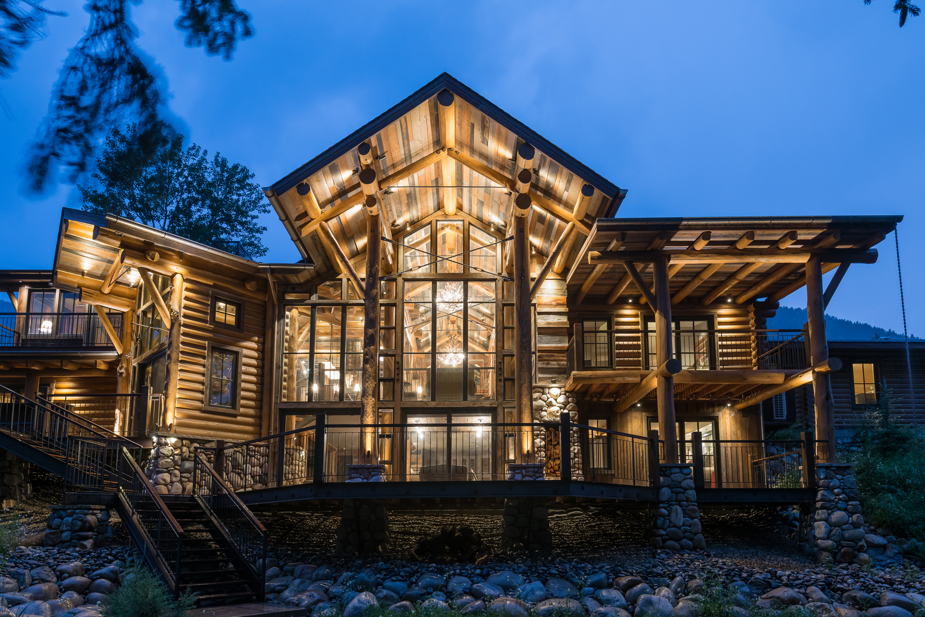 The back of the Red Lodge, Montana, cabin remodeled by Kibler & Kirch was expanded to embrace natural light and views of Rock Creek.