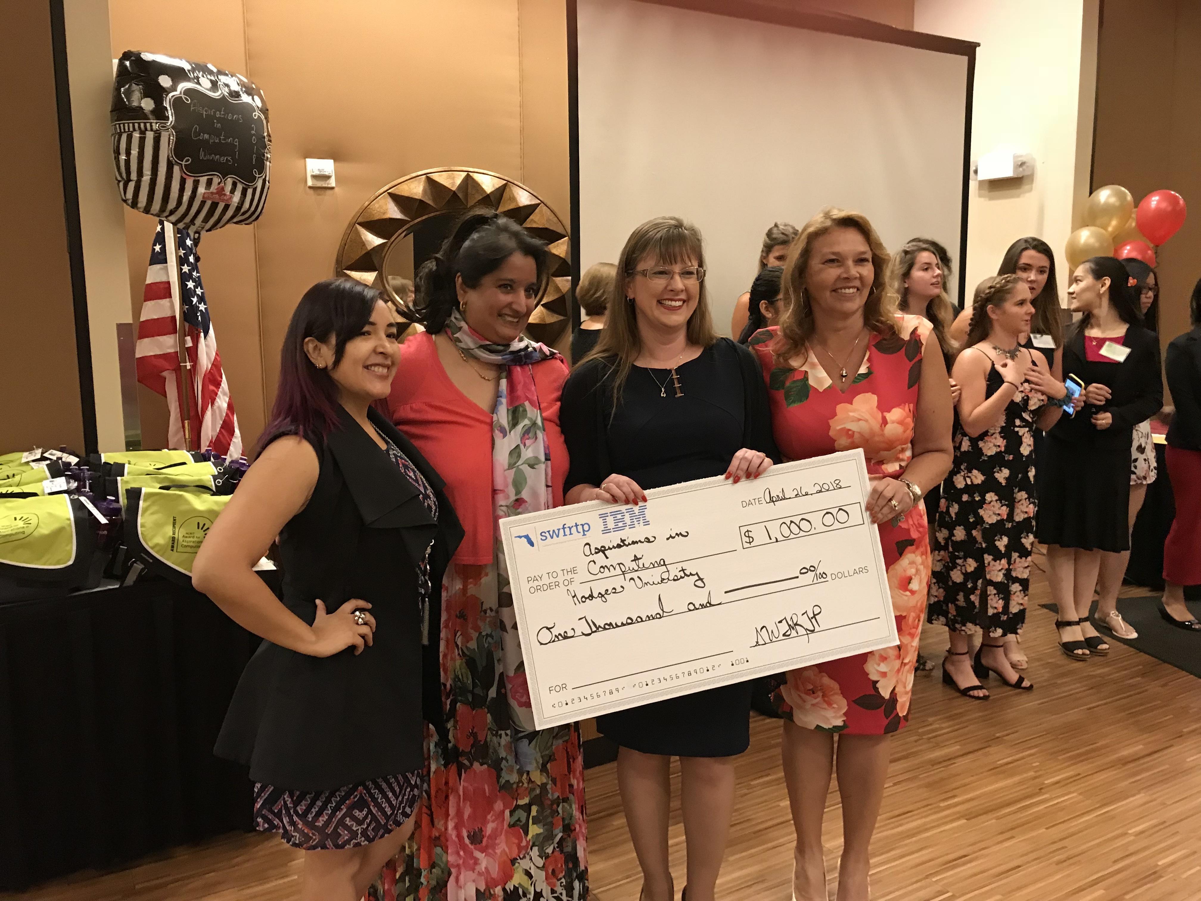 The Southwest Florida Regional Technology Partnership is the recipient of a discretionary grant from IBM. Pictured from Left: Zarela Graves, Aisha Reed,Tracey Lanham, Linda Lyding