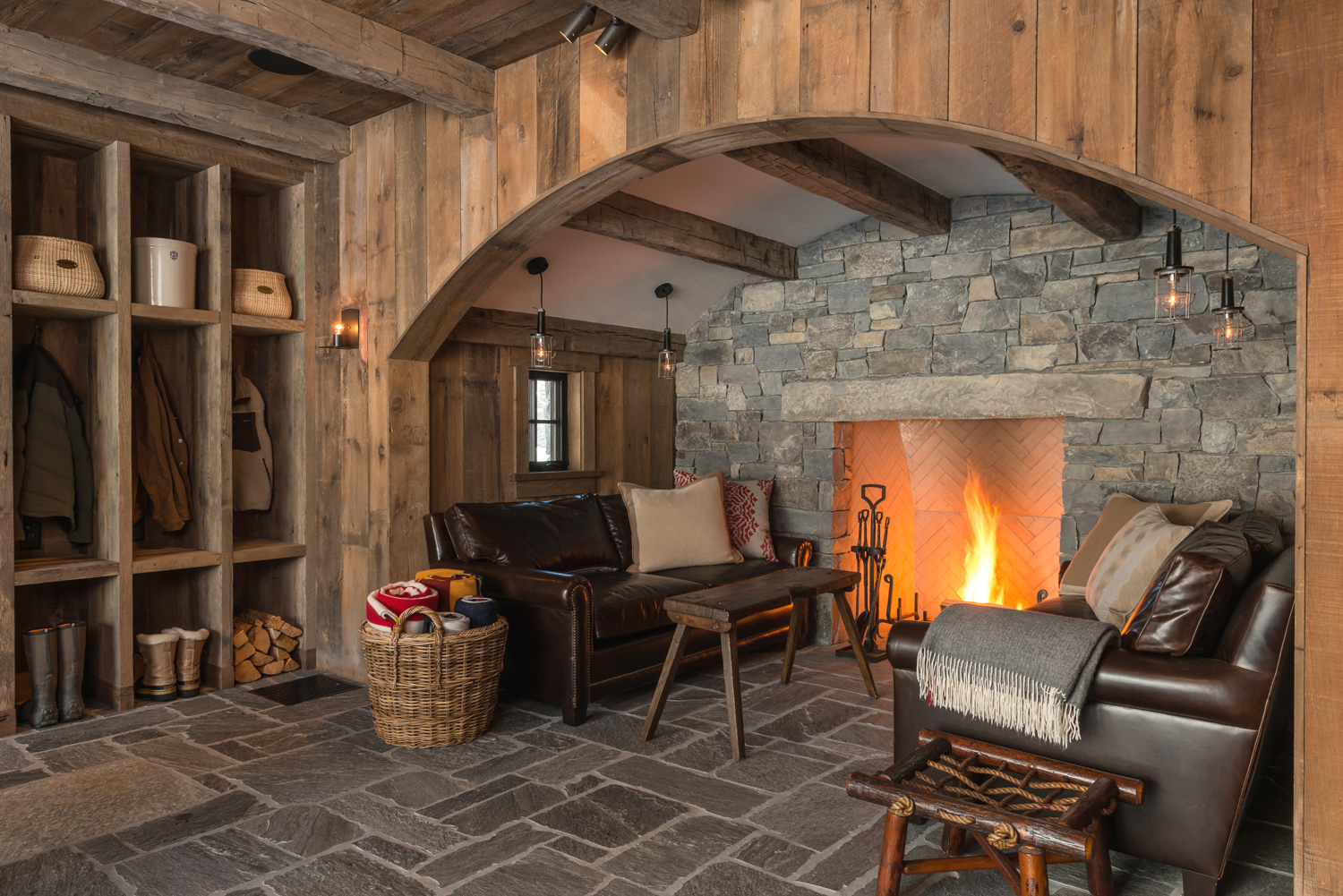 The stone and timber alcove references medieval European inglenooks in the JLF-designed Jackson Hole, Wyoming, house also featured in Mountain Living (photo by Audrey Hall).