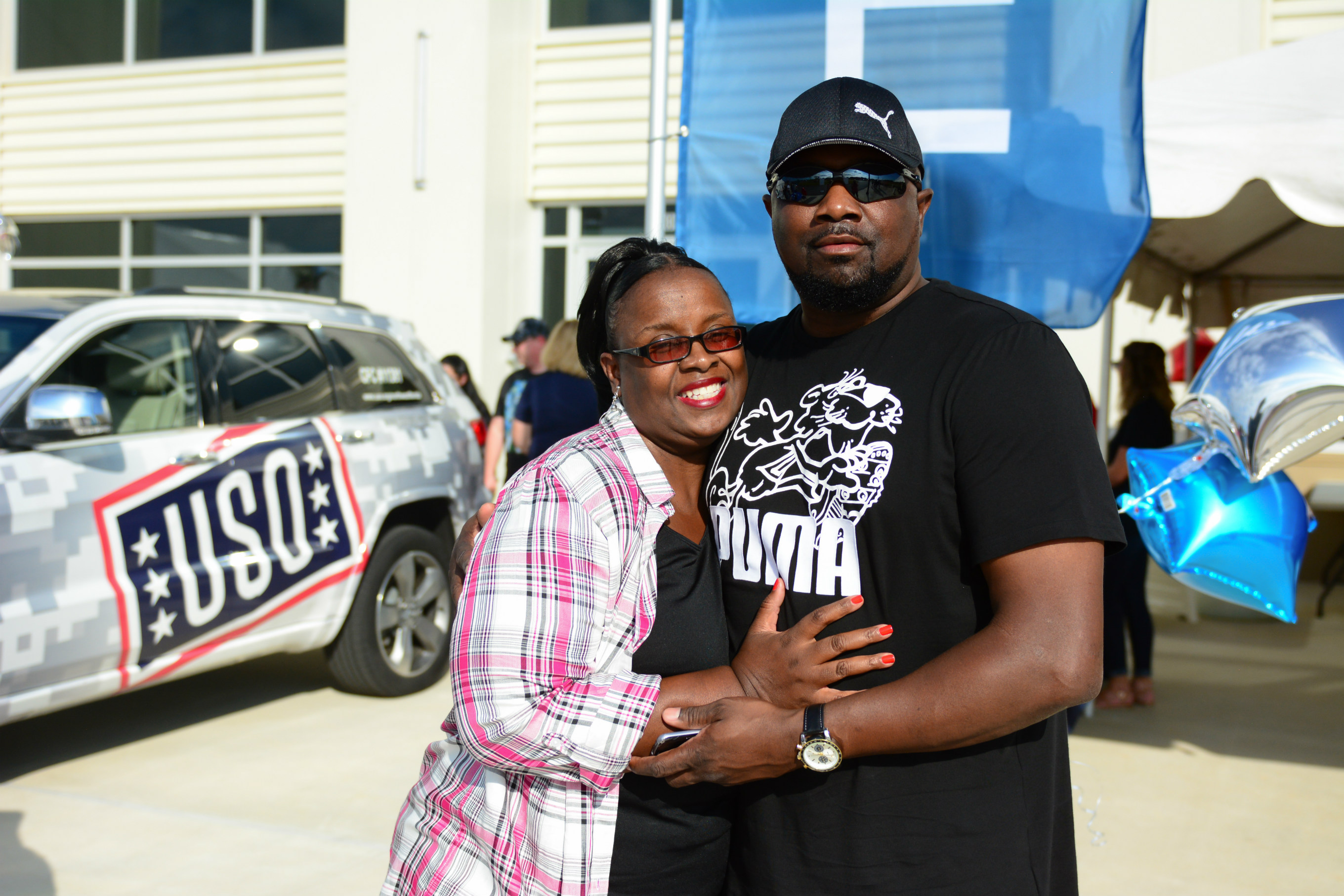 Columbia Southern University graduate Robert Clark, with wife Veronica, decorated bags for the USO Northwest Florida to benefit military men and women.