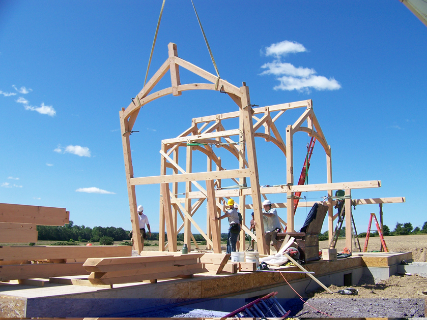 The raising day is an exciting event for all involved with a timber frame project. Here New Energy Works was raising the frame for a private home near Rochester, NY.