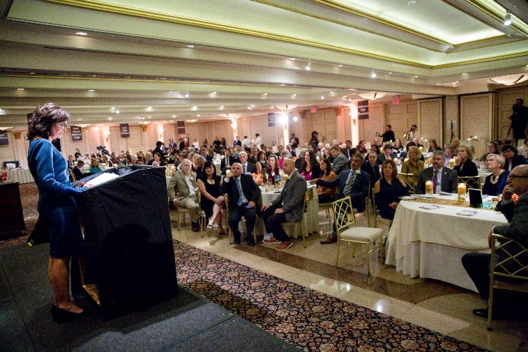 Tibisay (Tibi) Guzmán, executive director/CEO, The Arc Westchester, addresses a packed ballroom at “A Matter of Taste” on October 16 at the Glen Island Harbour Club. (Photo by: Eric Vitale Photography