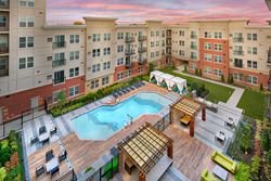 Sit poolside at The Remy Apartments
