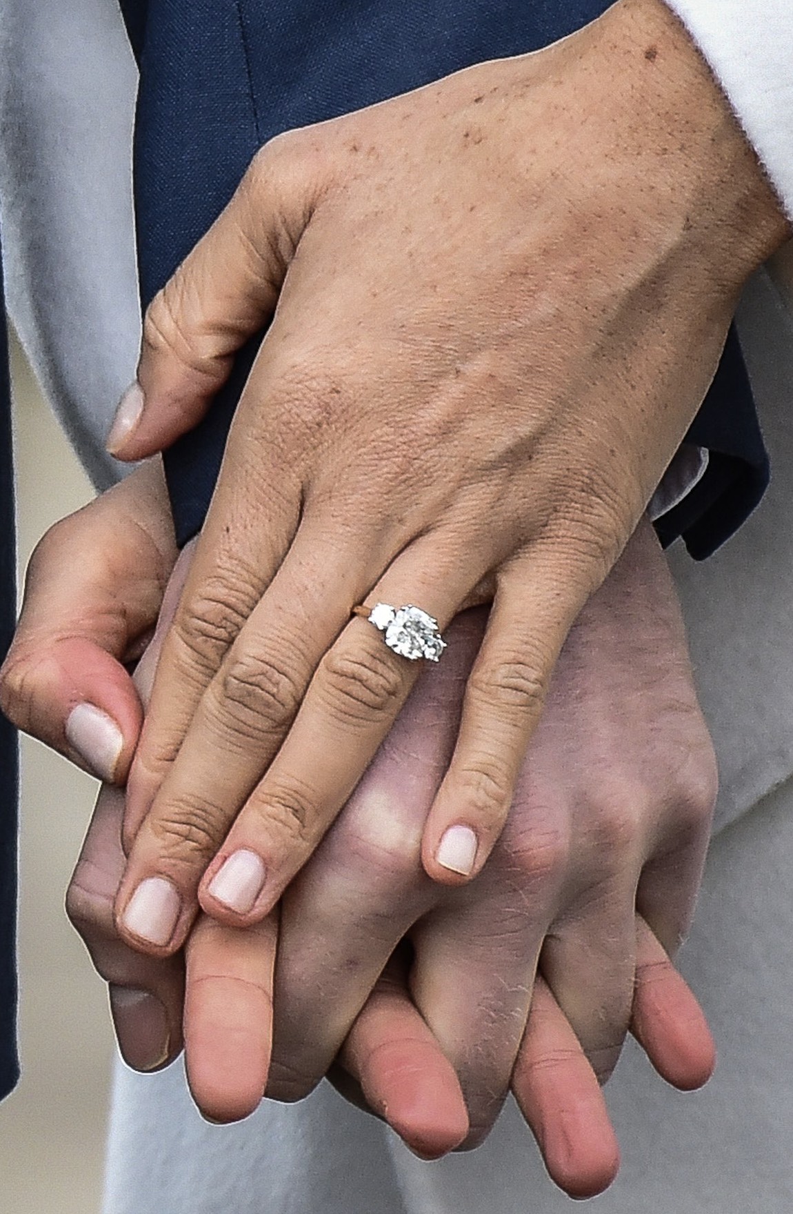Cleave & Co. Engagement Ring for Meghan Markle made to Prince Harry's specifications featuring a center stone from Botswana flanked by two diamonds from Princess Diana’s personal collection