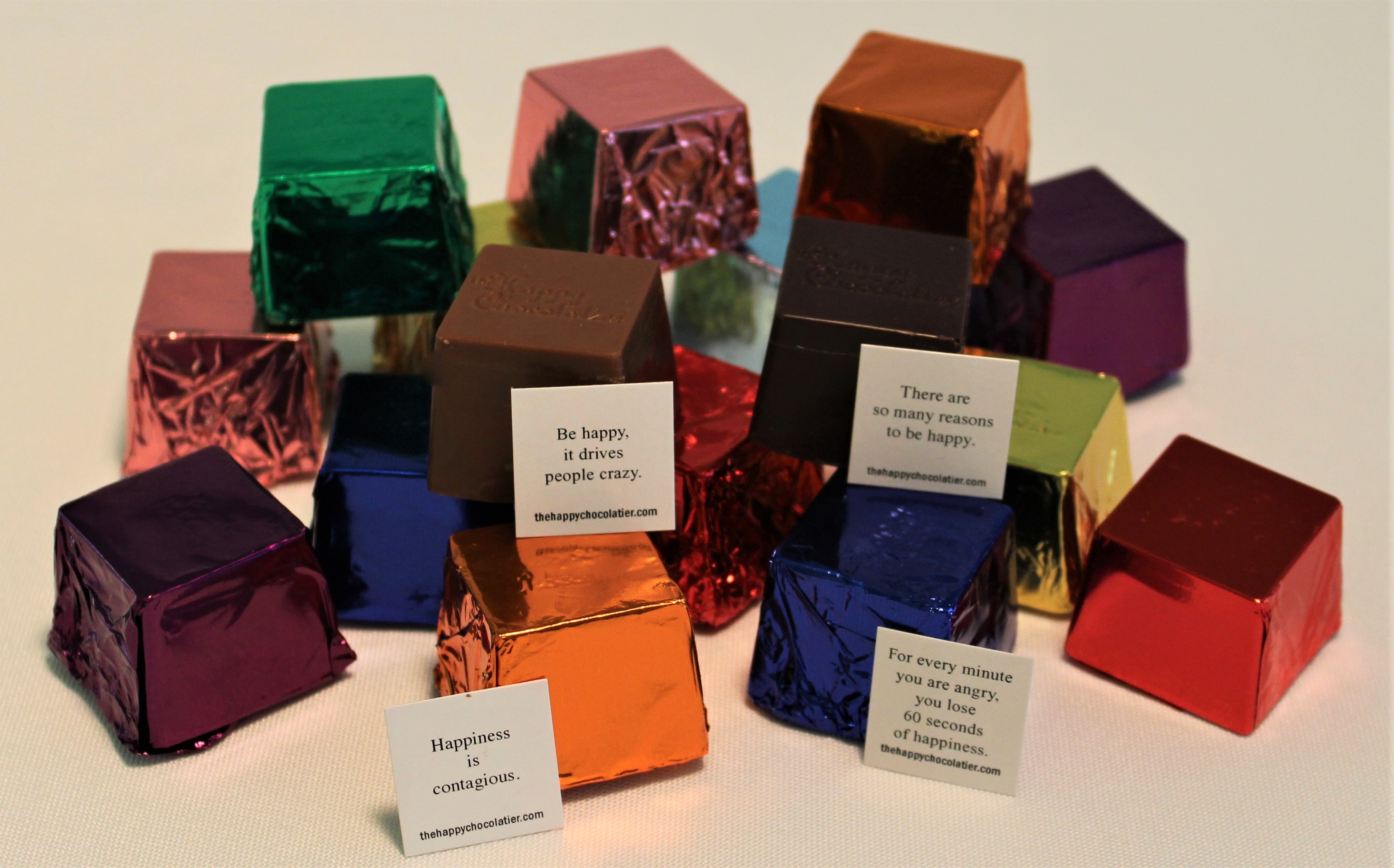 Colorfully wrapped cube-shaped chocolate truffles called Cubze from The Happy Chocolatier