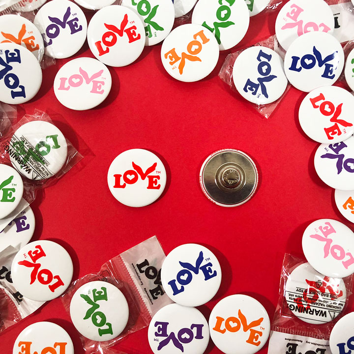 Wear the Love Button to show you believe in love and its power to transform our world. Love Button supports educational and humanitarian programs that empower individuals.