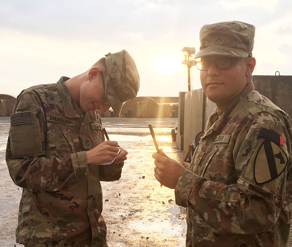 Soldiers in Iraq try out their new wood pens from the Woodcraft Turn for Troops program.