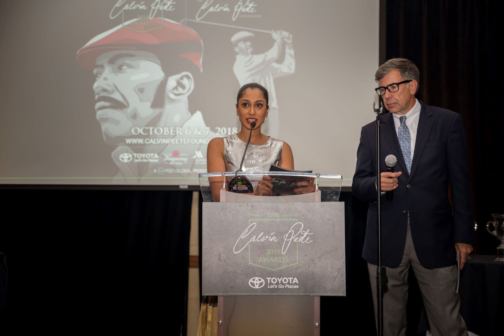 Hosts Seema Sadekar and Mark Winne make opening remarks at The 2018 Calvin Peete Awards at Marriott Buckhead Atlanta on October 6th
