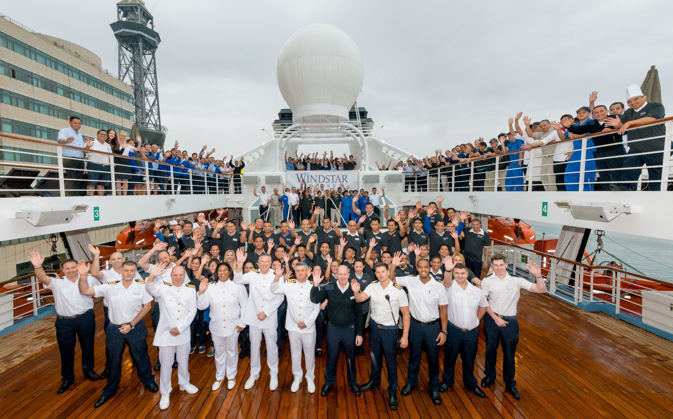 The crews of Star Breeze, Wind Surf, and Wind Star on Star Breeze send their greetings from Barcelona. (Photo credit: Benjamin Arthur)