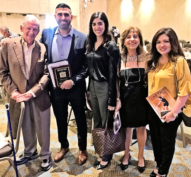 Bob Page CEO of SD METRO joins Andrew Feghali and his family--wife Amanda Feghali, mother Maguy Feghali, and mother-in-law Adriana Shayota at the 40 Under 40 Luncheon.