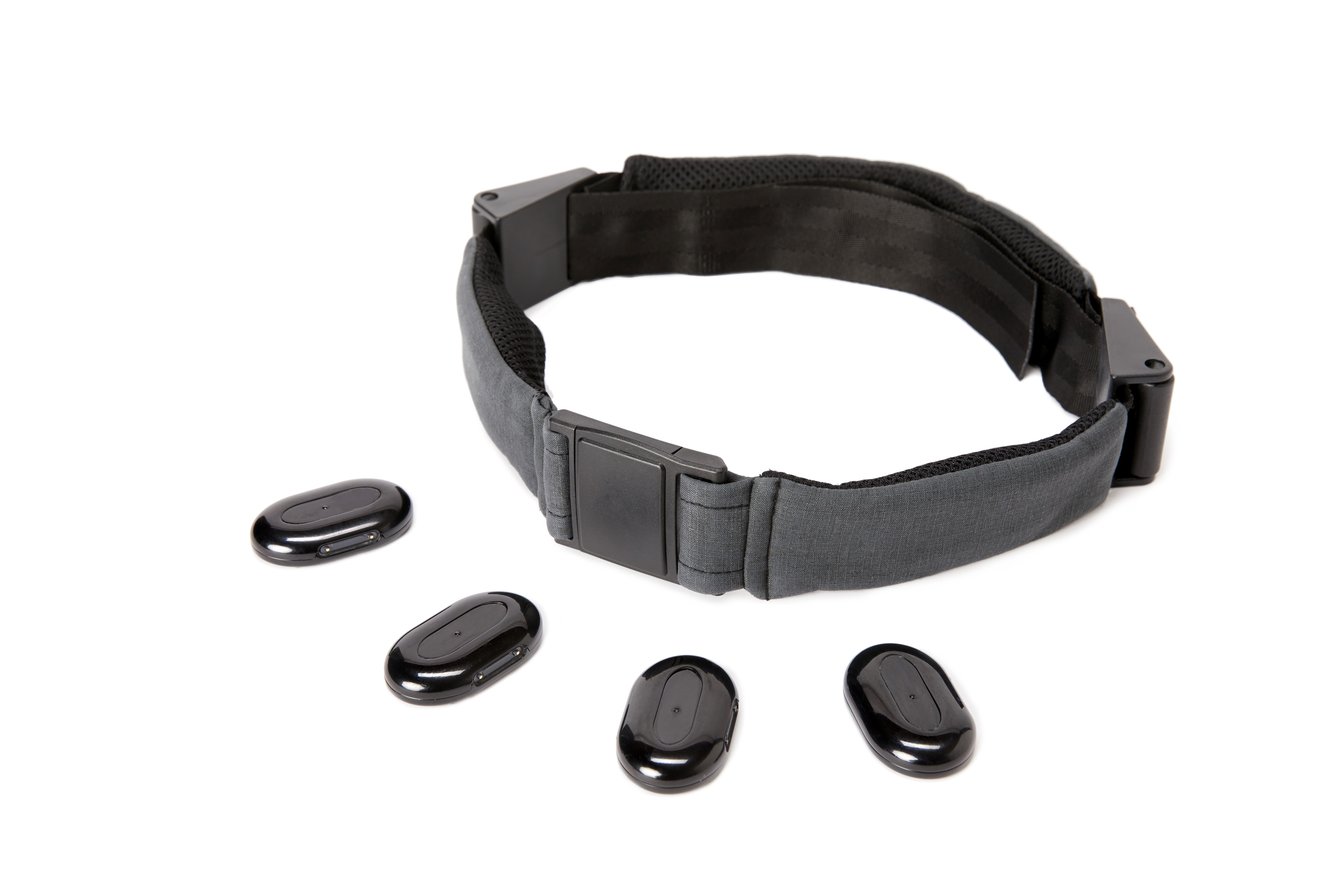 The wearable technology system includes adhesive, haptic-enabled Stones, the BassBelt, and a mobile app.