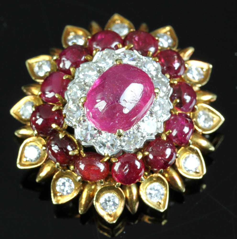 Signed David Webb 18k gold and platinum brooch having cabochon rubies surrounded by diamonds